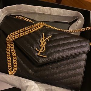 YSL
Monogramme quilted textured-leather clutch bag